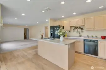 Kitchen and nook looking into the rear family room