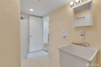 Main floor mudroom off the garage with utility sink and pantry space
