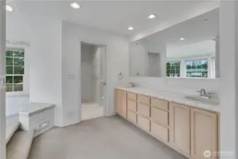 Primary bathroom with 2 sinks, walk in shower and Jacuzzi tub