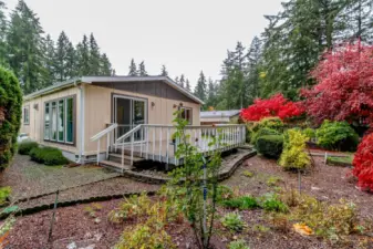 Mature landscaping and full length deck.