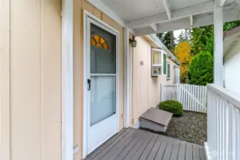 Covered back porch with entry into the utility room.