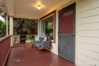 Accessibility ramps leads up to covered front porch