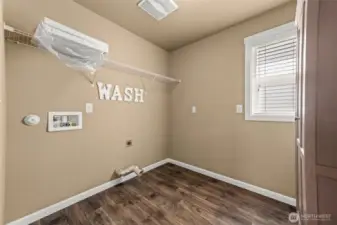 Untility room located upstairs.