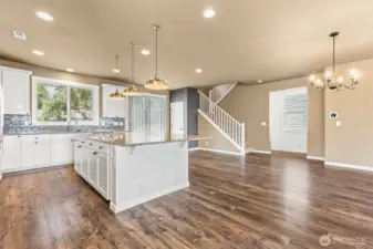 Heart of the home...DREAM custom kitchen with huge island and generous storage/counter space. Sit 6-8 bar stools.