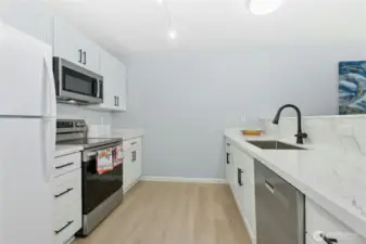 Beautiful kitchen with new cabinets, hardware, sink, faucet
