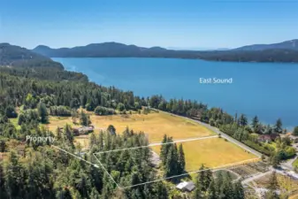 Nearly 4.5 acres of level land and no CC&Rs. Imagine the possibilities! Current home is already connected to Eastsound Water, private septic, and power.