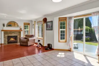 Abundant windows fill the home with natural light, while the cozy gas fireplace creates a warm and inviting ambiance on chilly winter nights