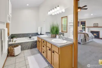 A great view of primary bath looking into the bedroom.