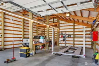 9 foot door leads you to this side of shop that is 33 feet deep. Plenty of room for all your toys, this lift is staying!
