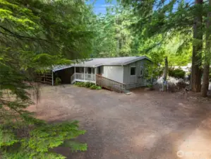 Welcome home to this tranquil Olalla acreage.