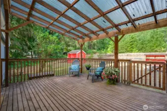 Another view of the large patio with both steps and a ramp the backyard.