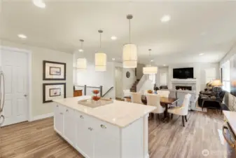 Kitchen flows to the dining room,  living room and great room.
