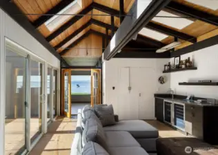 French doors to kitchen, dining and living room, can be closed if you desire privacy and quiet from the waterfront side of the home.