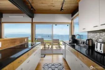 View from kitchen of sliders to waterfront deck.