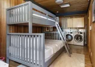 Bunk room off with laundry in the rear.foyer