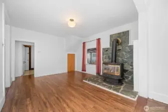 Living room leads into a potential sitting area or dining area.