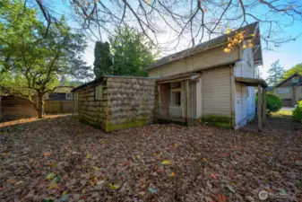 Back of home and storage shed
