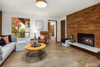 Just off the casual dining nook, this cozy fireside family room/den can flex to suit your needs.