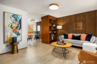 Built-in library shelving & warm wood paneling make this an inviting retreat.