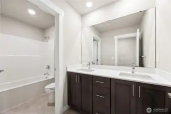 Upstairs bath, vanity with dual sinks.
