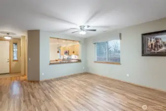 From the greatroom looking back to the dining room and open air breakfast bar. A perfect home for entertaining.