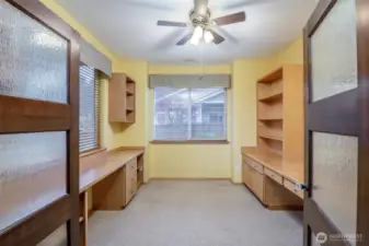 Off the great room are beautiful french doors leading to this custom den/hobby room with a gorgeous view of the peaceful backyard.