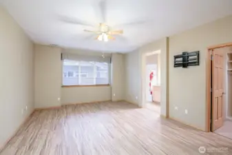 This primary suite has wonderful natural light, a 3/4 bath and built-in custom California Closet System.