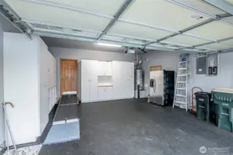 The garage has work space, parking space, and storage space, all on the epoxy garage floor that looks immaculate!