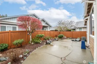Outside, the backyard is peaceful and full of possibilities with a retractable power awning that operates by remote control with a backup manual systme. This space can be enjoyed no matter what the weather.