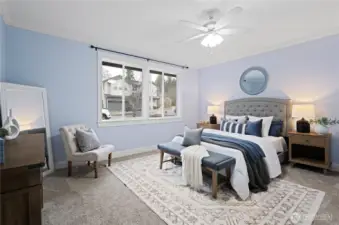 Rare main-floor primary suite complete with bathroom heated floors and spacious walk-in closet.