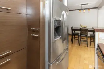 Such unique storage in the kitchen. Peaking into dining room area.
