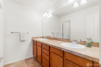 Dual sinks in primary suite bathroom