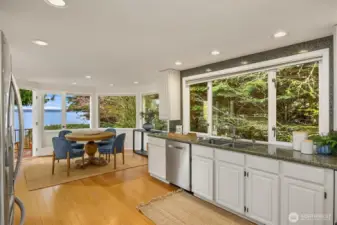 Kitchen open to dining with tons of natural lighting