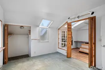 Upper level loft space would make a perfect office with ample natural light.