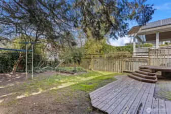 Good sized backyard connects to entertainment sized deck and large connected covered parking.