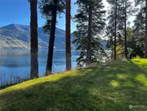 View of grassy community waterfront area on Lake Chelan.