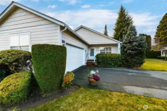 2 car garage with storage and shelving. Only 3 stairs up from garage