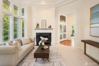 The formal living room features refined finishes and a serene, light-filled atmosphere.