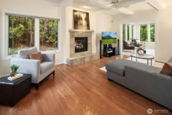 The family room offers a cozy retreat with a warm fireplace and inviting ambiance.