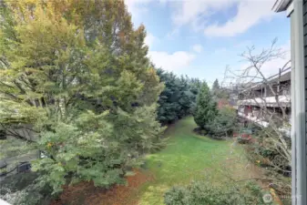 Back lawn/garden area provides privacy from your back deck