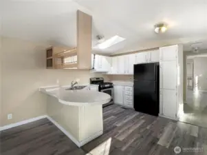 The kitchen includes a breakfast bar, making it ideal for entertaining.