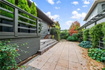 Yard features two decks and complementary Pergola