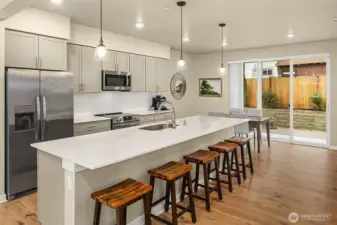 kitchen, dinning area with access and views of the deck and backyard.