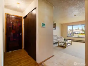 The exit to the garage is conveniently located in the hallway across from the entry way.