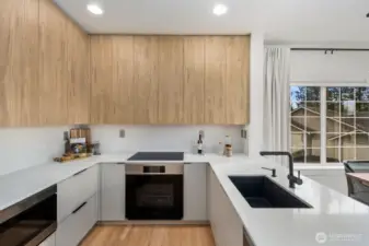 Sleek cabinetry and quartz countertops