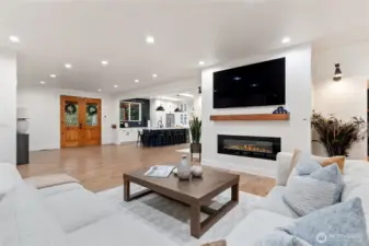View of family room into entry way and kitchen