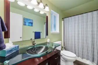 Full guest bathroom, with glass sink