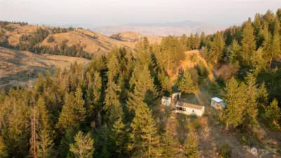 Cabins on upper 20 acres include solar power and woodstoves