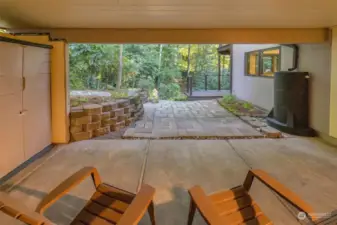 Covered patio on the lower level outside the shop.