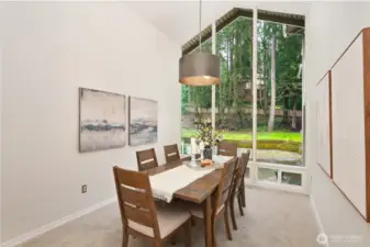 Formal dining area has oversized windows too.